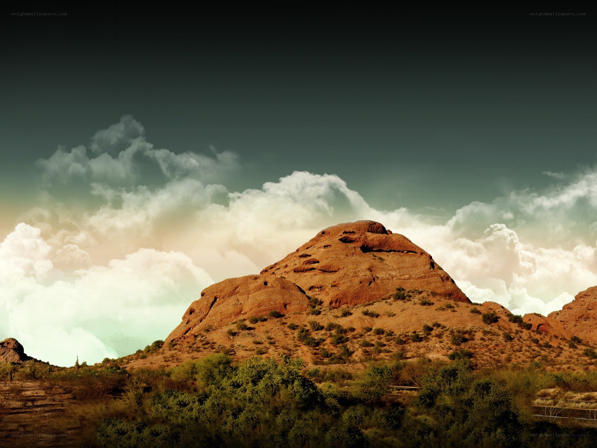 Desert rock formation under cloudy sky