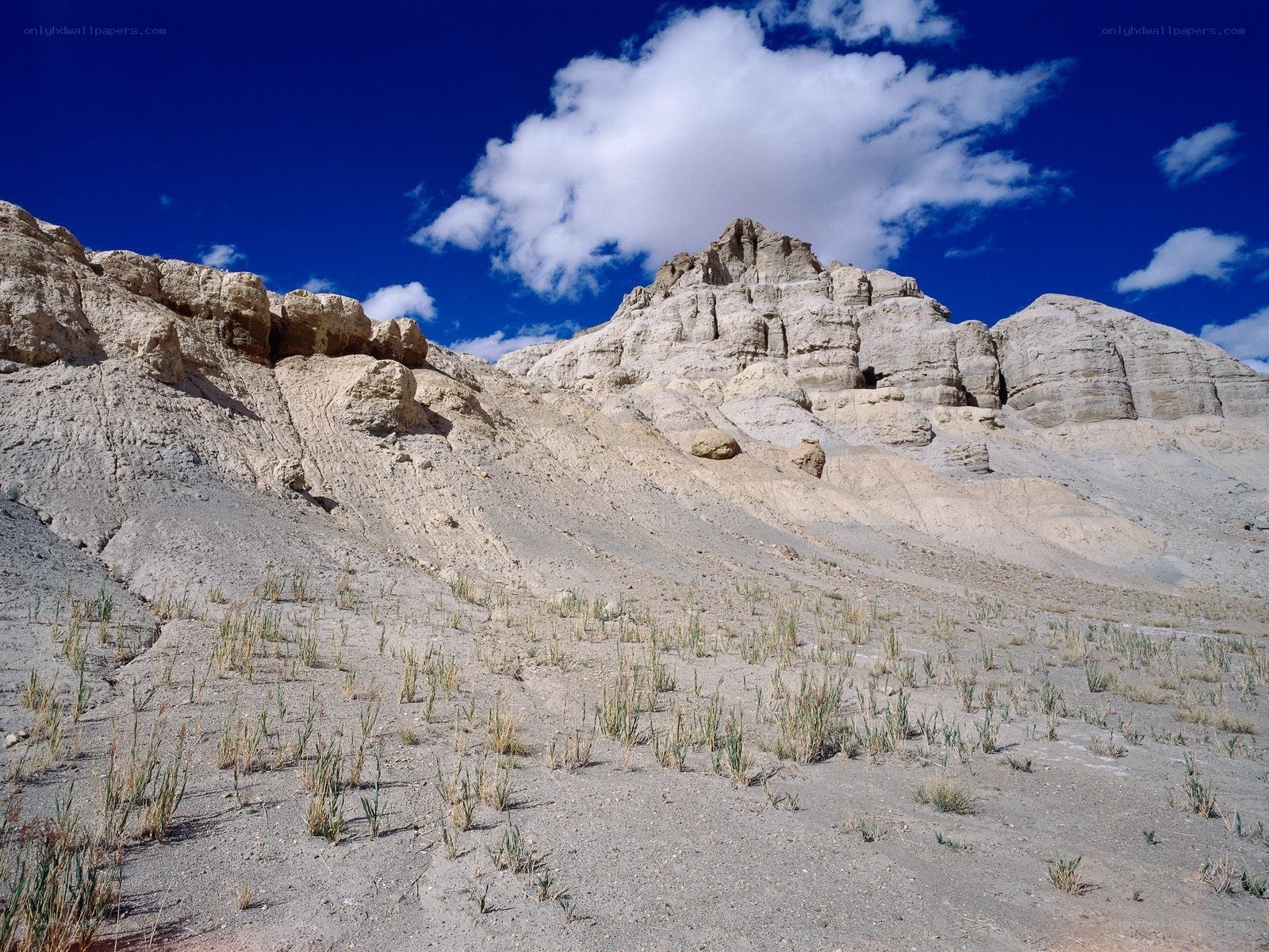 Desert rock formations under blue sky