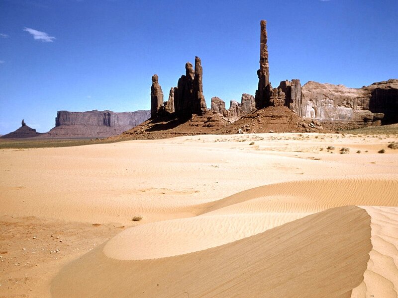 Desert rock formations under blue sky