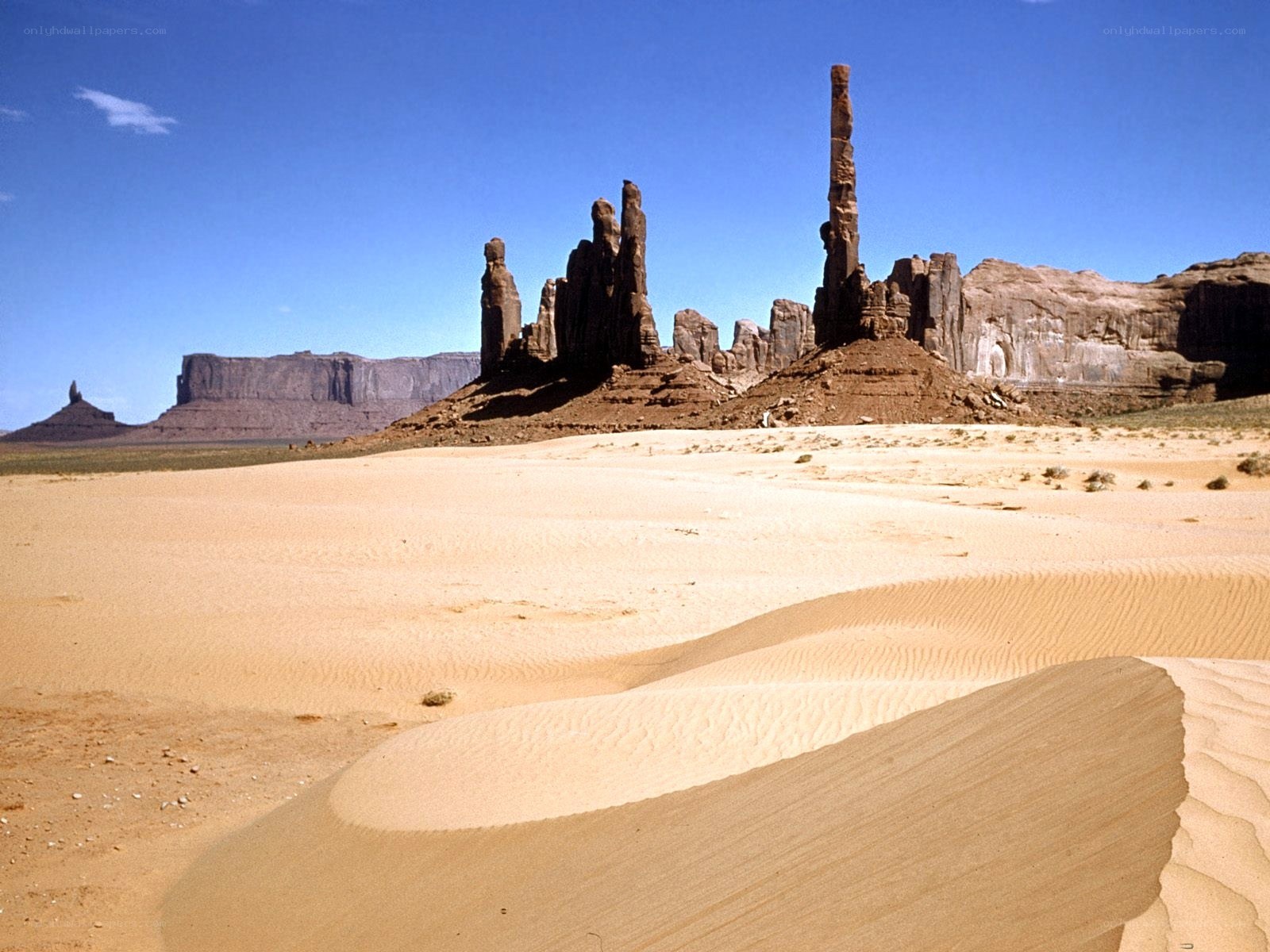 Desert rock formations under blue sky