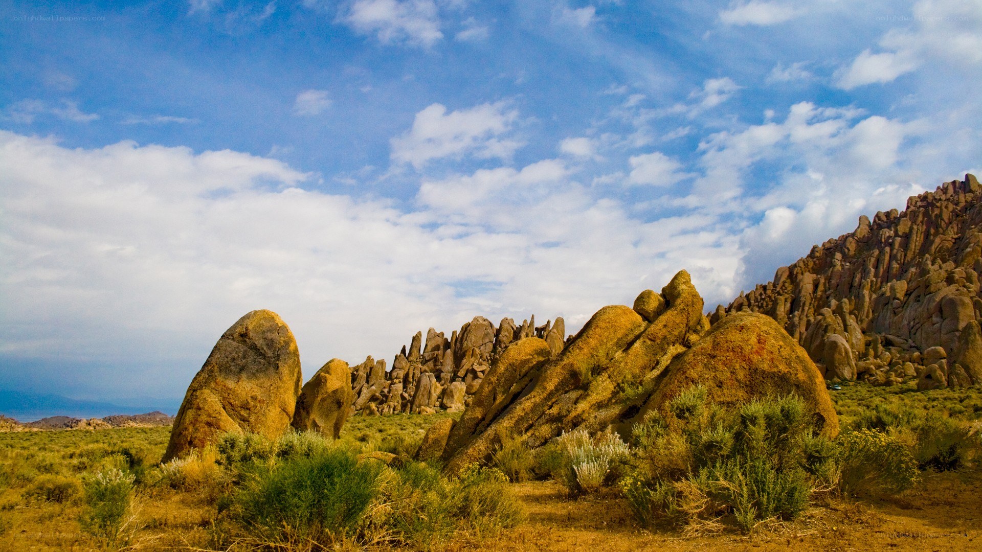 Desert rock formations under blue sky