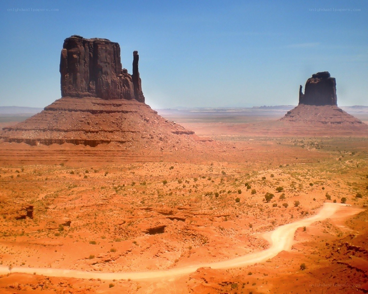 Desert rock formations under blue sky