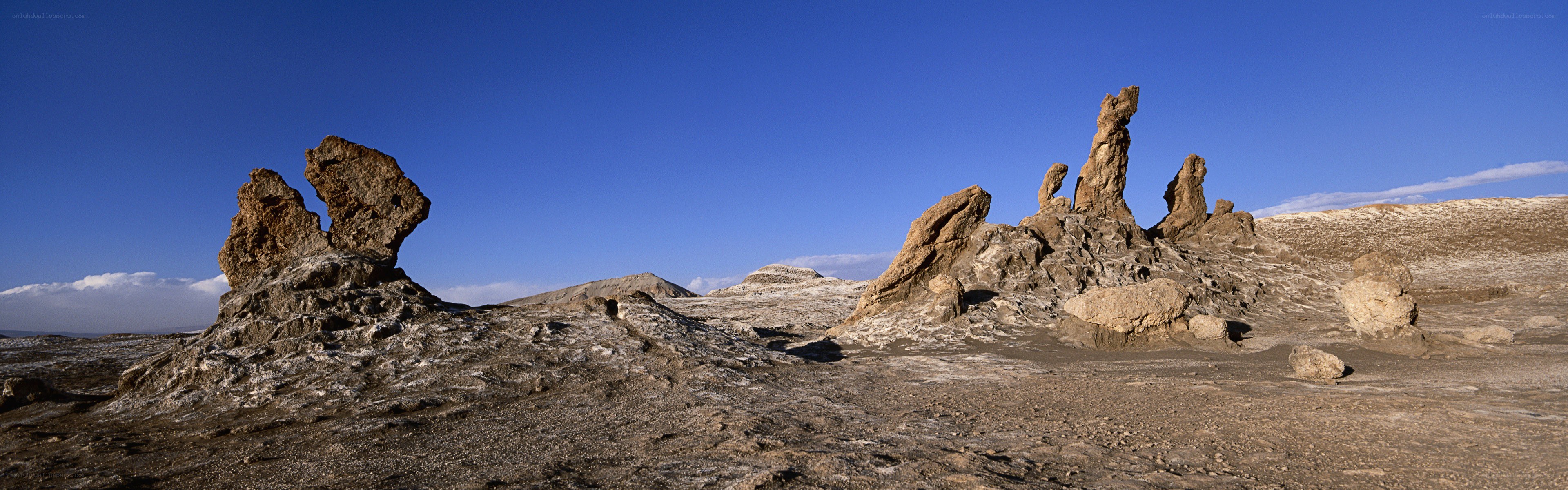 Desert rock formations under blue sky