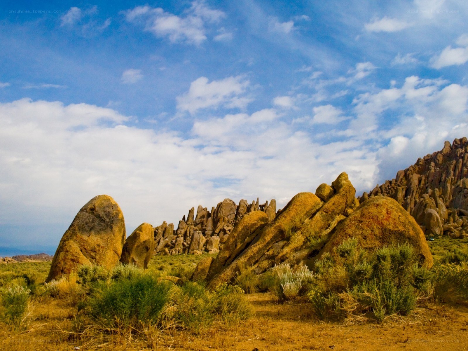 Desert rock formations under blue sky