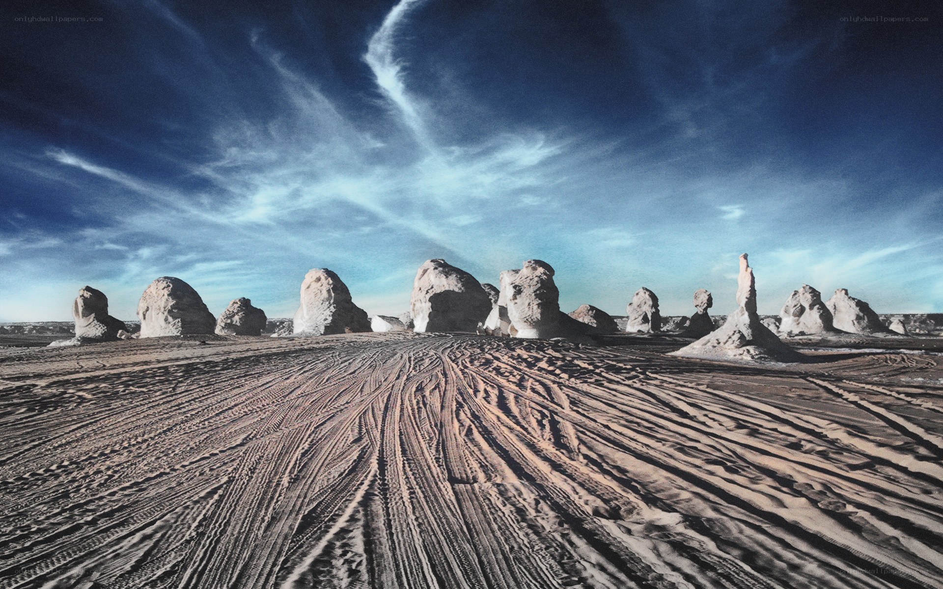 Desert rock formations under blue sky