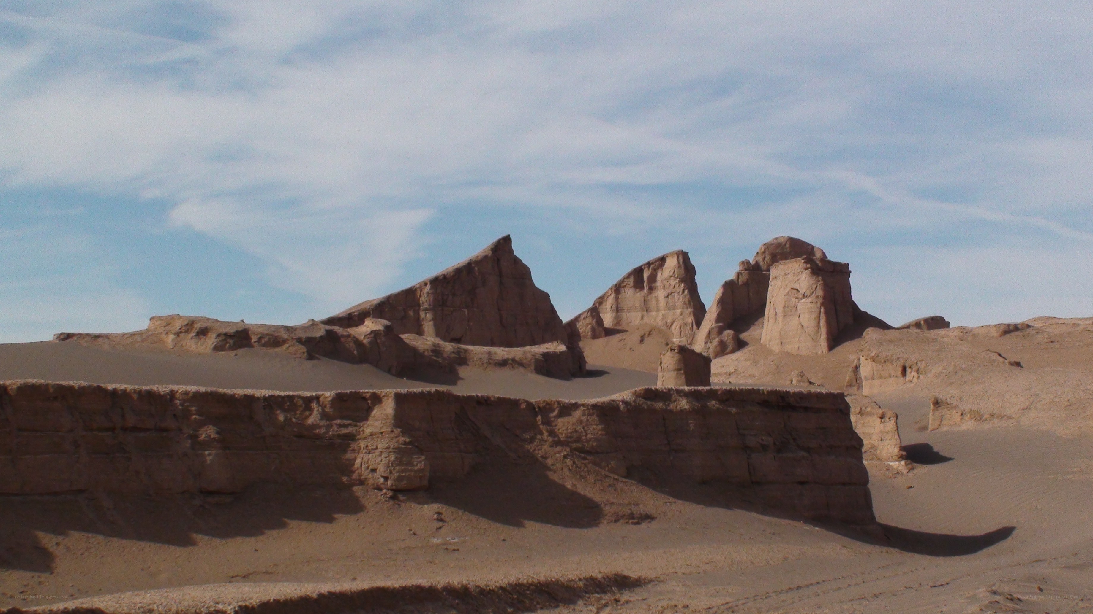 Desert rock formations under blue sky