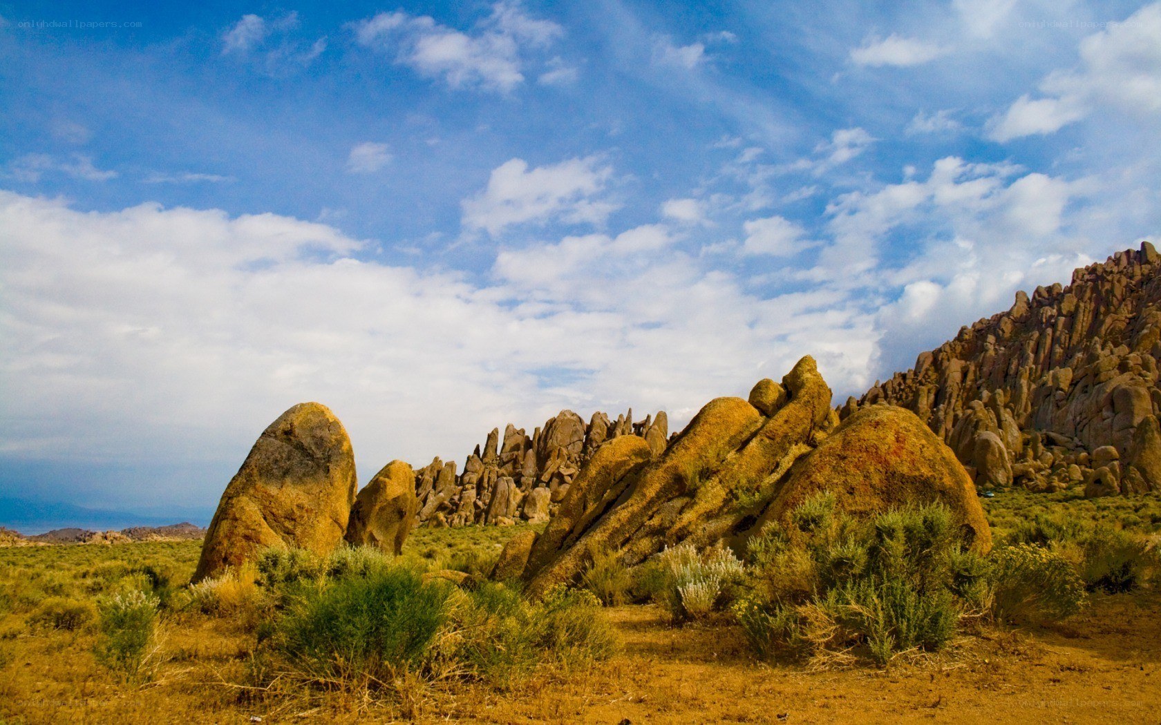 Desert rock formations under blue sky