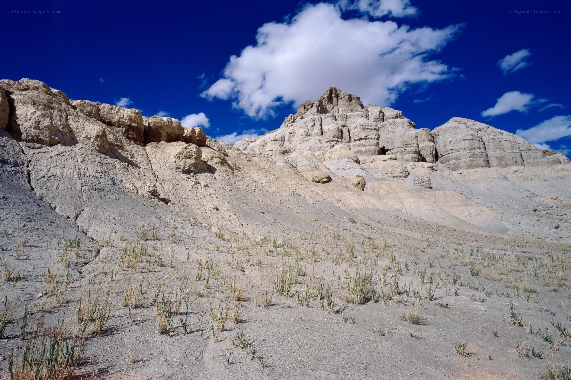 Desert rock formations under blue sky