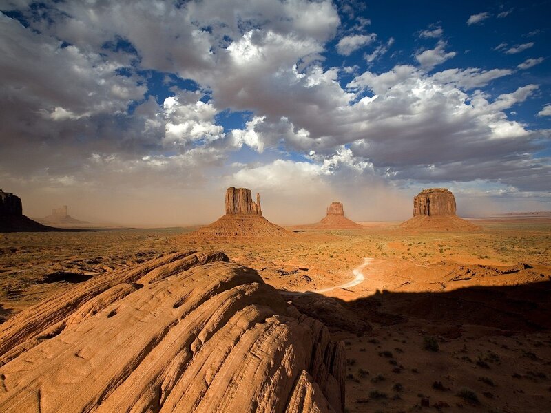 Desert rock formations under cloudy sky