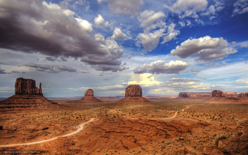 Desert rock formations under cloudy sky
