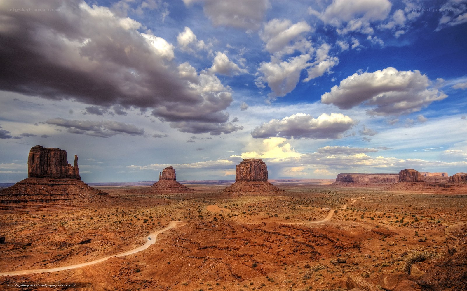Desert rock formations under cloudy sky