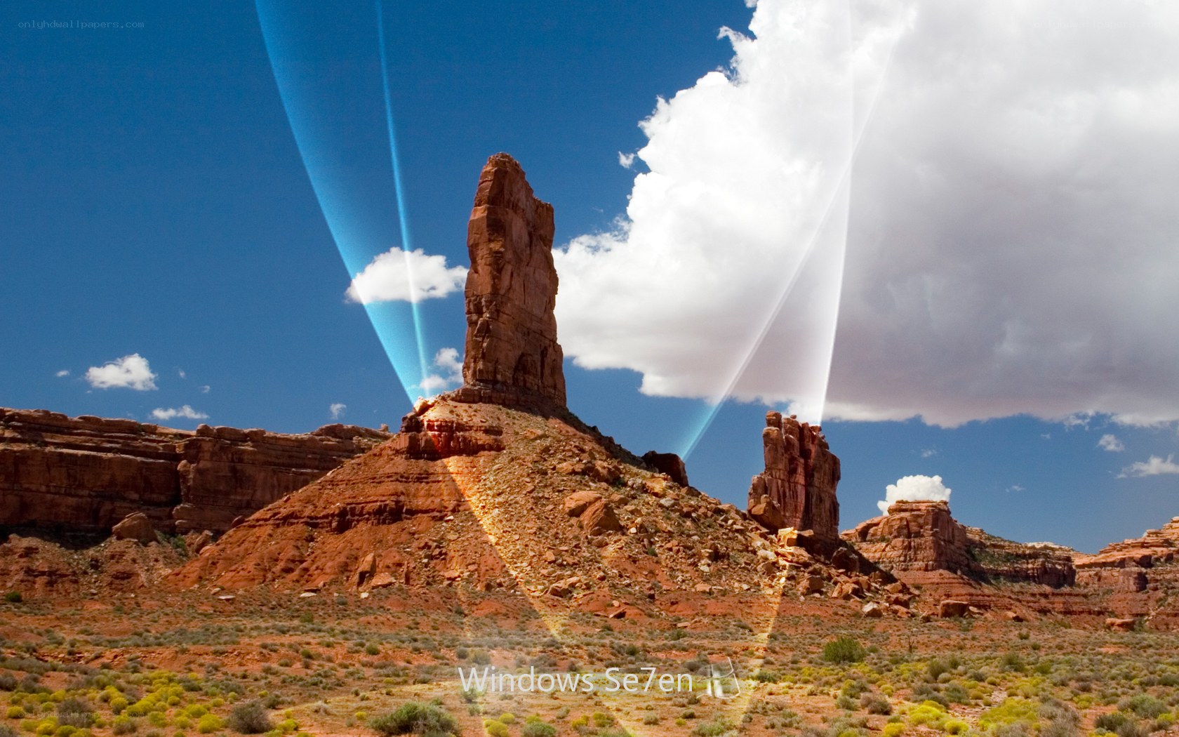 Desert rock formations with light beams