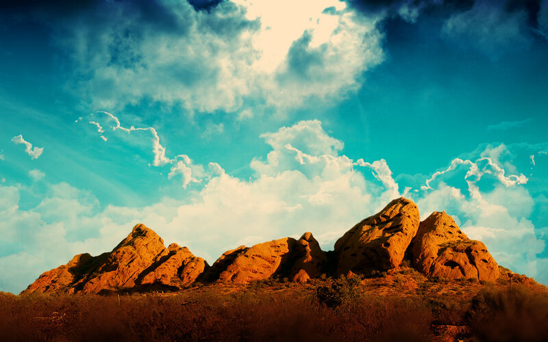 Desert rocks under cloudy sky