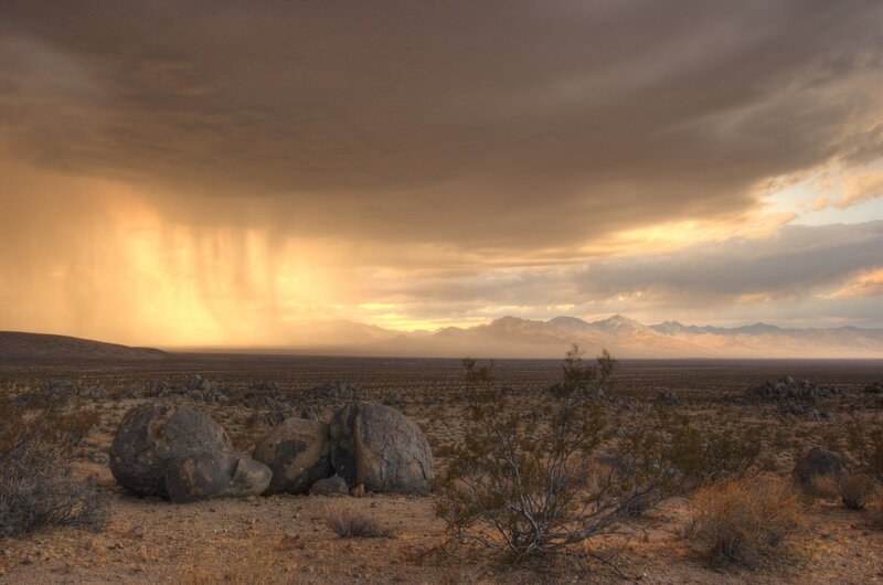 Desert storm at sunset
