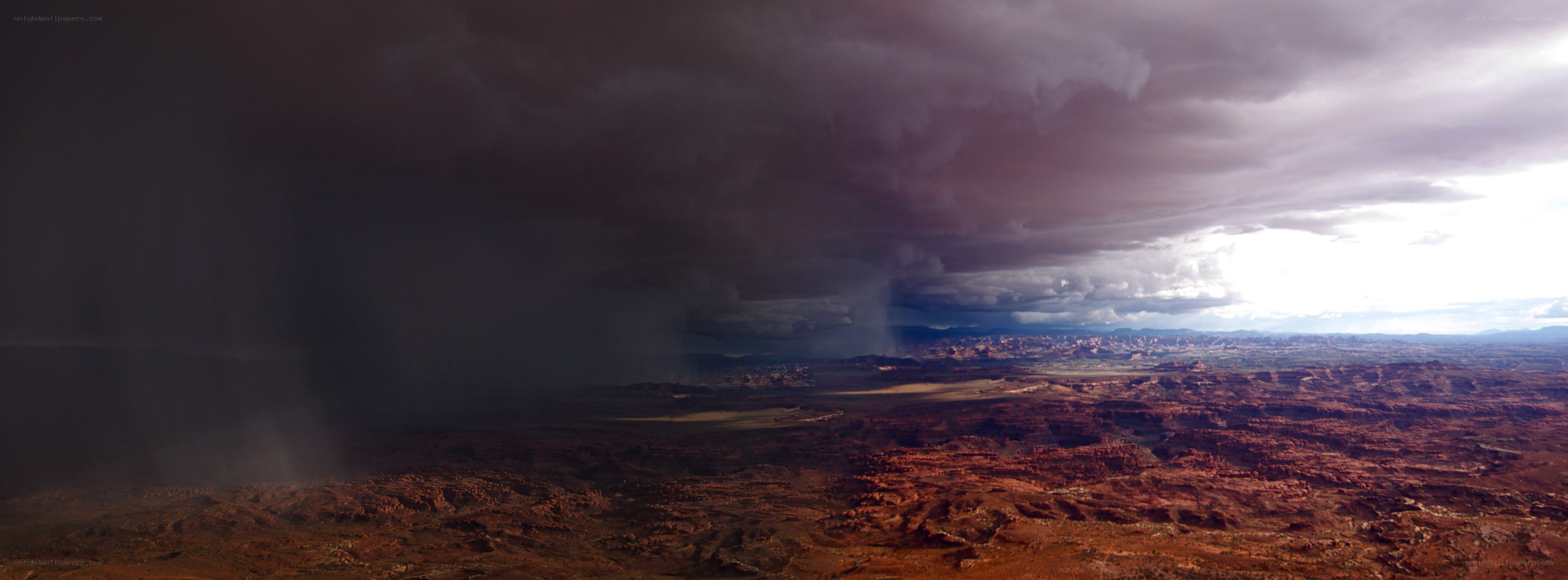Desert storm over red rock