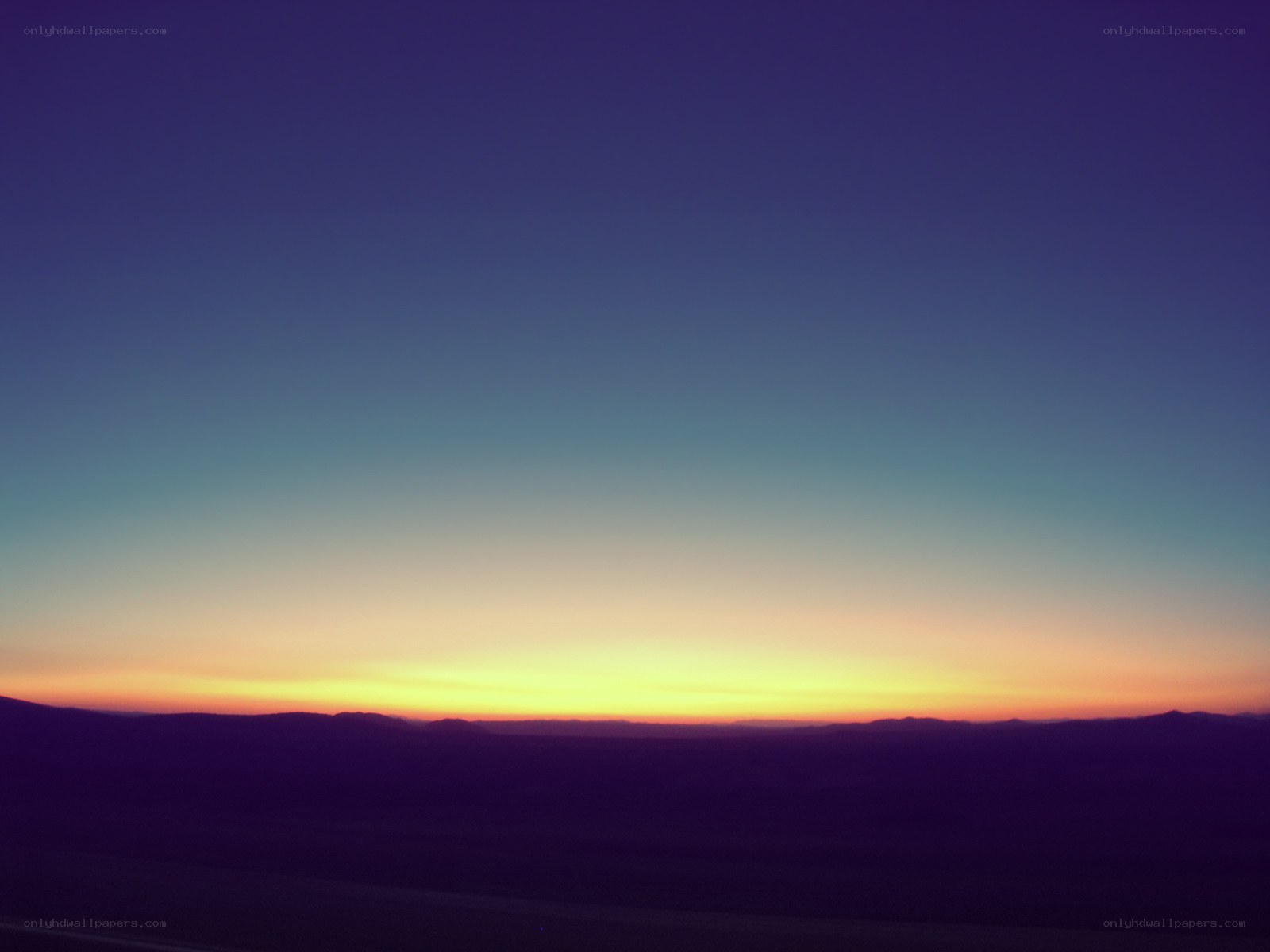 Desert sunset with purple sky