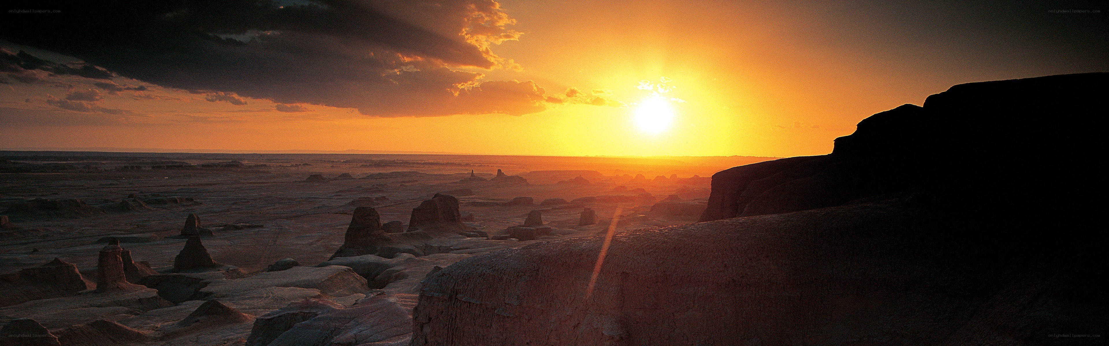 Desert sunset with rock formations