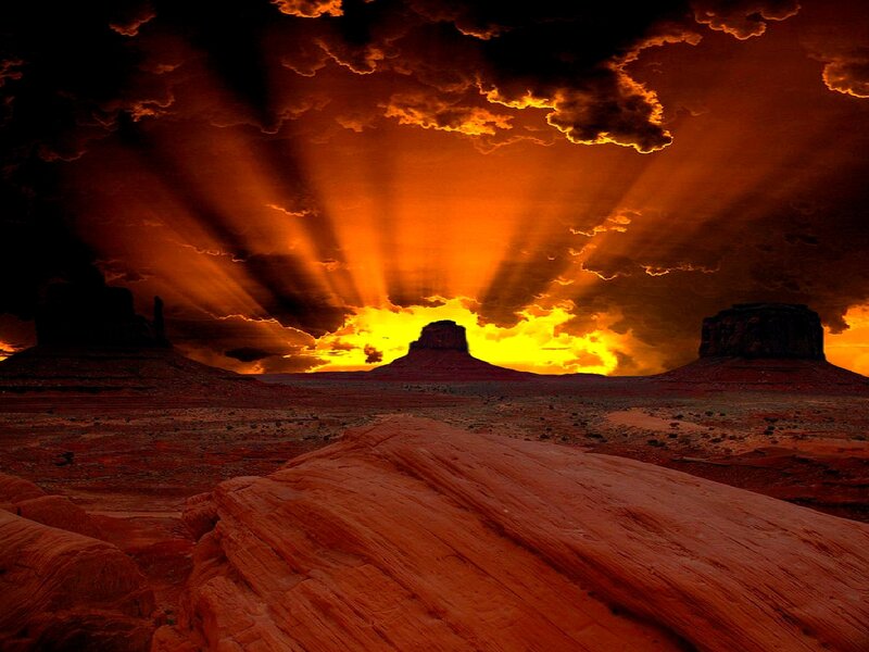 Desert sunset with sunbeams