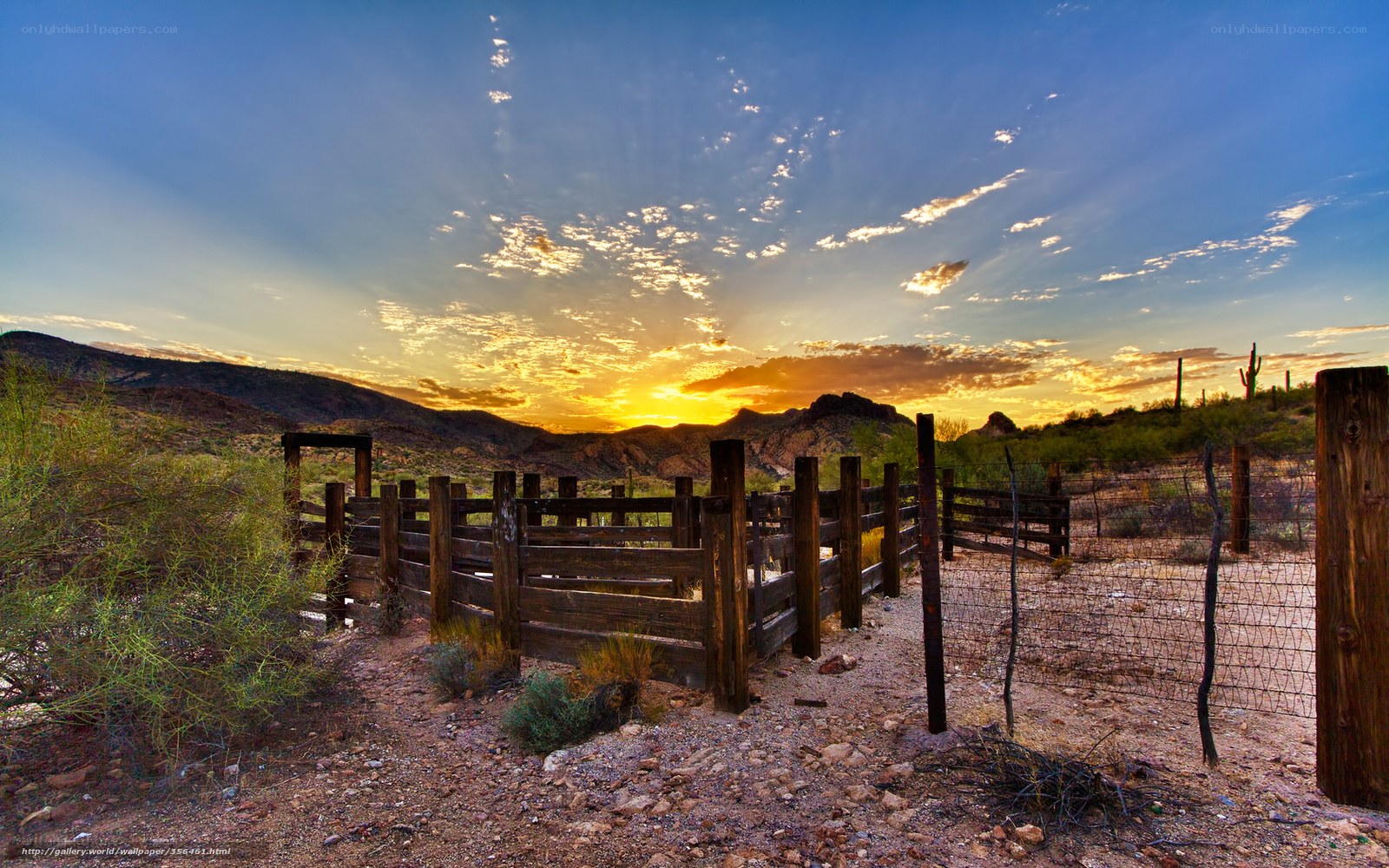 Desert sunset with wooden fence