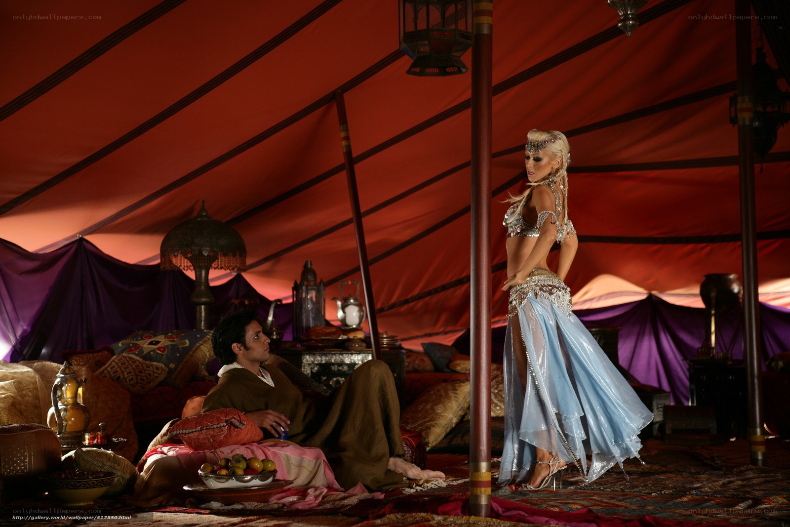 Desert tent scene with dancers