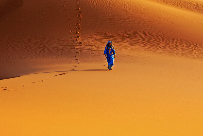 Desert traveler in blue robe