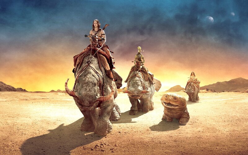Desert travelers on alien beasts