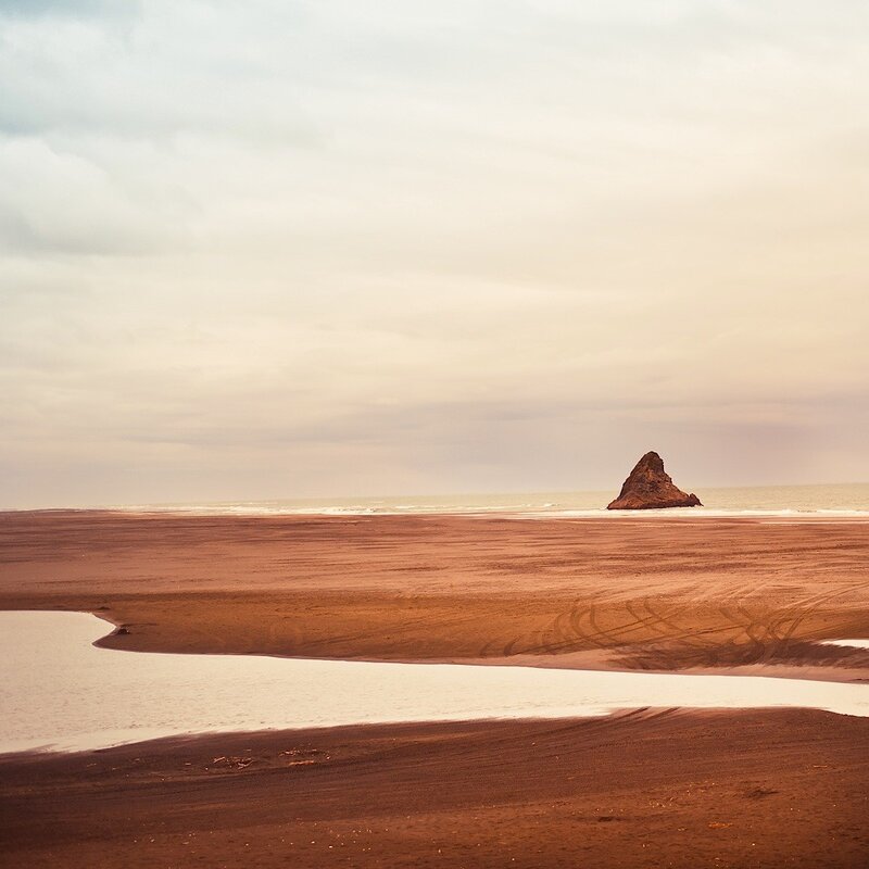 Deserted beach with sea stack