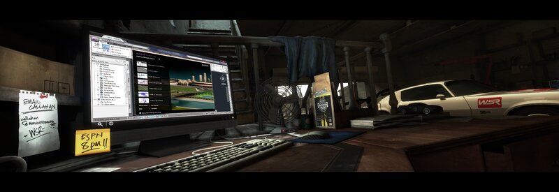 desk in a garage with computer