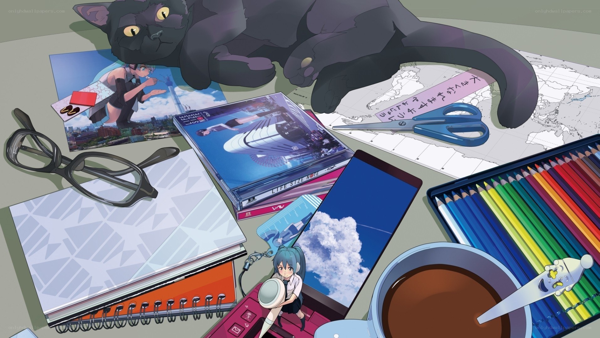 desk with art supplies and cat