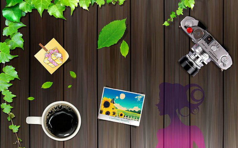 desk with camera and coffee