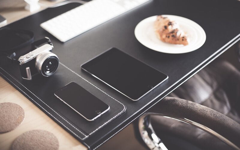 desk with camera and tablet