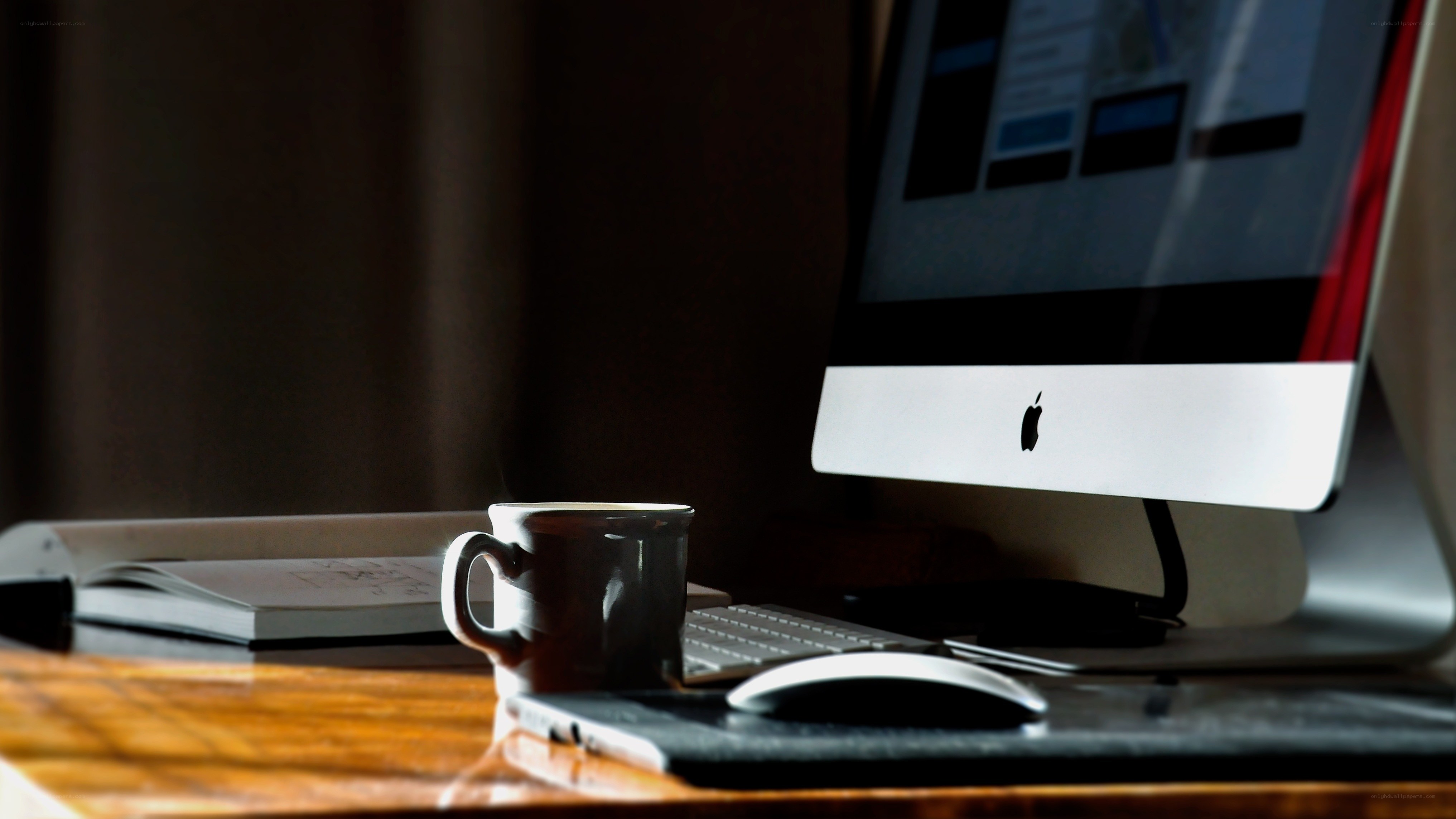 desk with computer and coffee