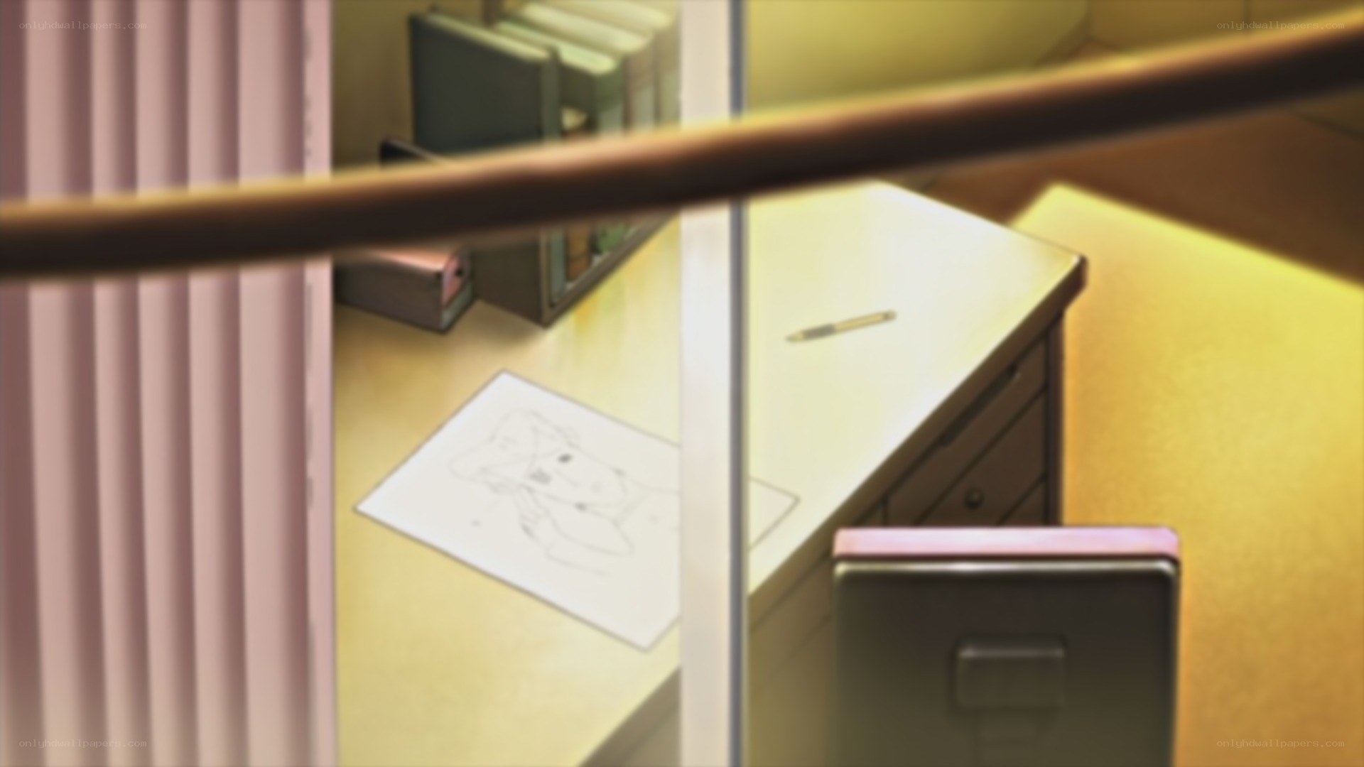 desk with drawing and pen