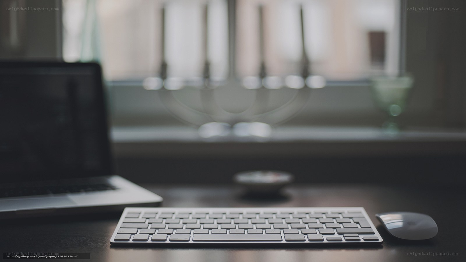desk with keyboard and laptop