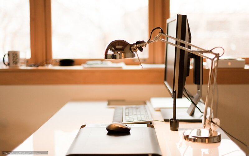 desk with lamp and computer
