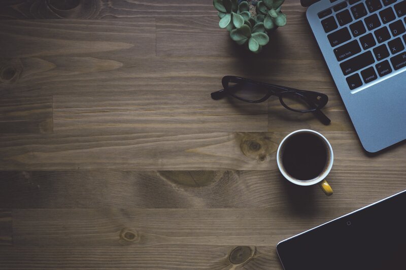 desk with laptop and coffee