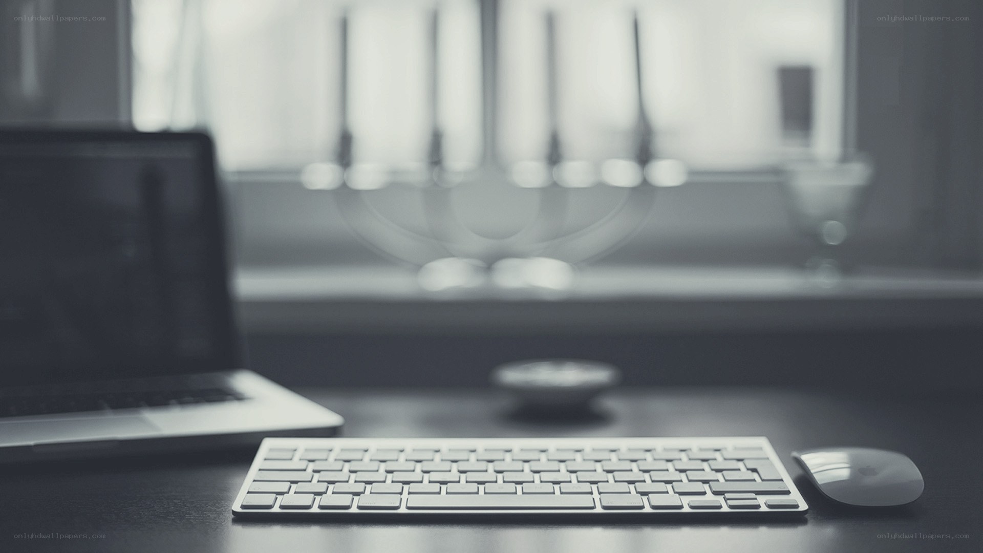 desk with laptop and keyboard