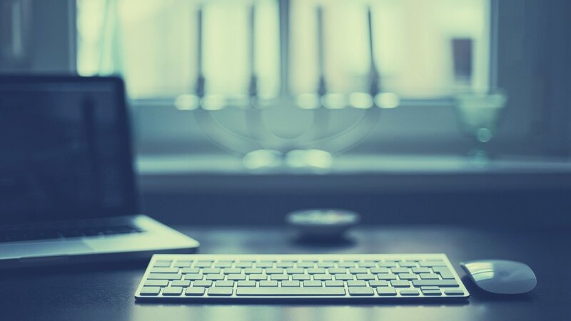 desk with laptop and keyboard