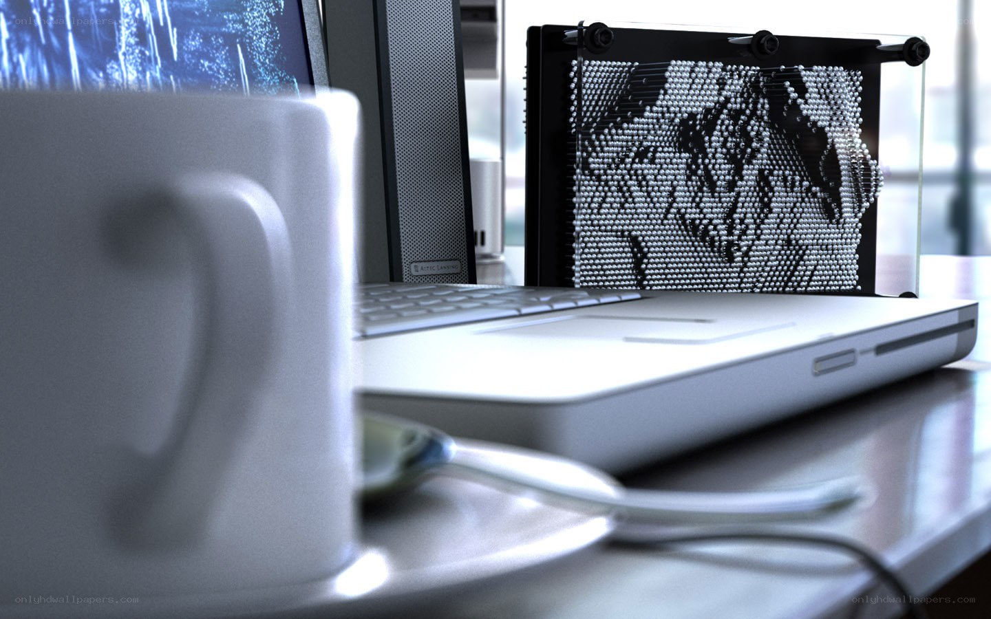 desk with laptop and mug