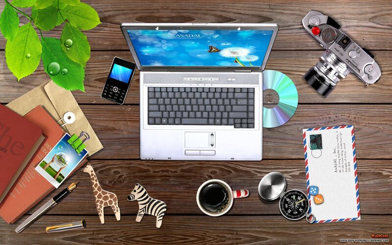 desk with laptop and office supplies