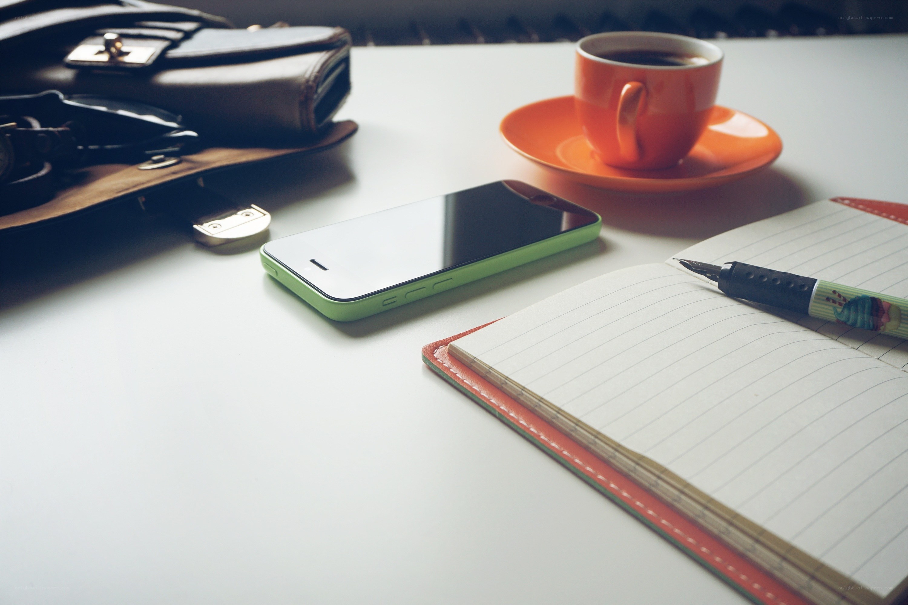 desk with phone and coffee