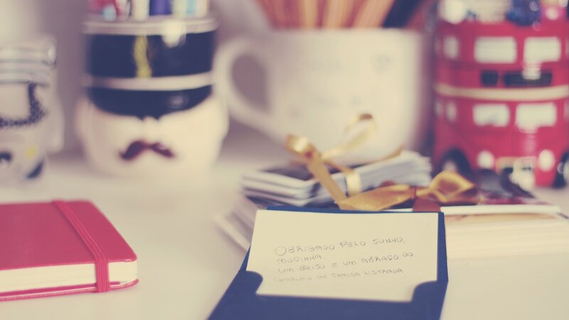 desk with stationery and note