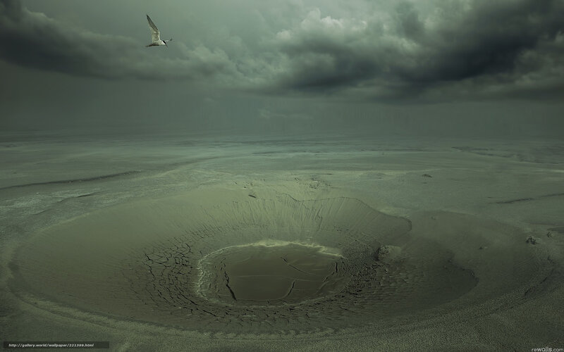 Desolate crater under stormy sky
