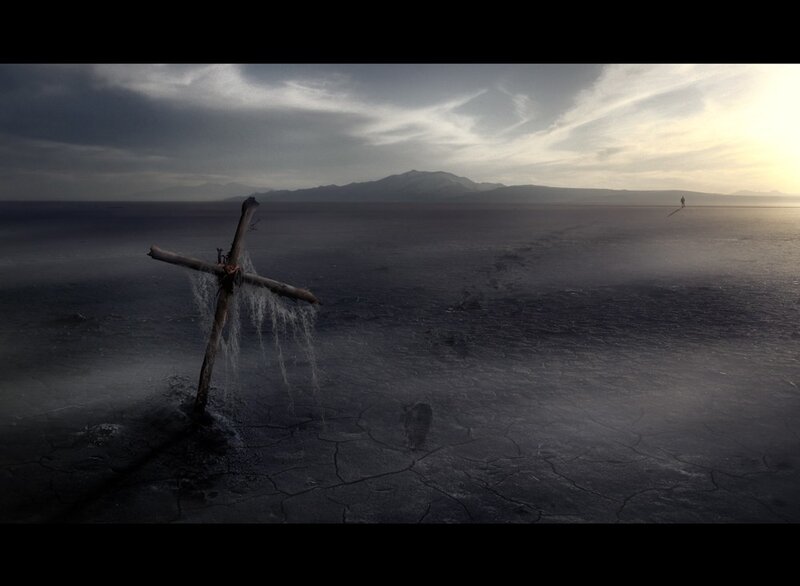 Desolate cross in cracked earth