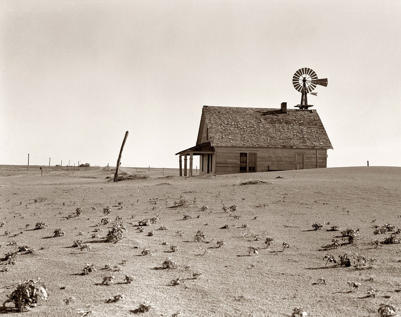 Desolate farmhouse with windmill