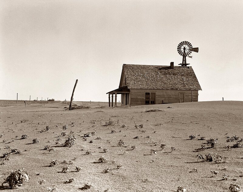 Desolate farmhouse with windmill