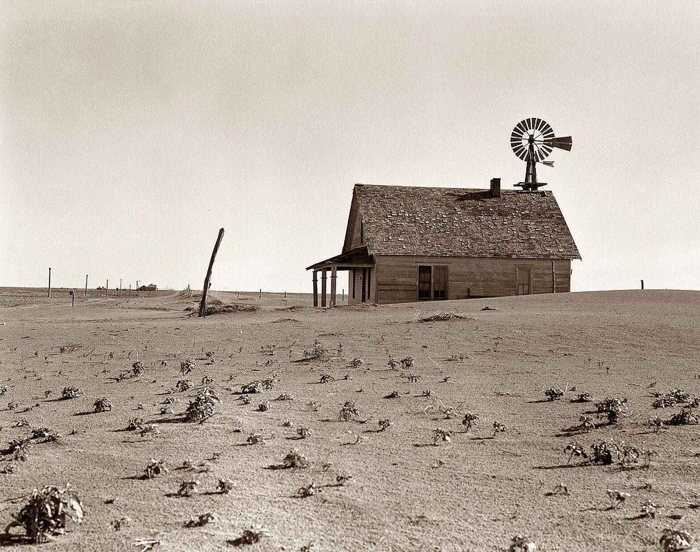 Desolate farmhouse with windmill