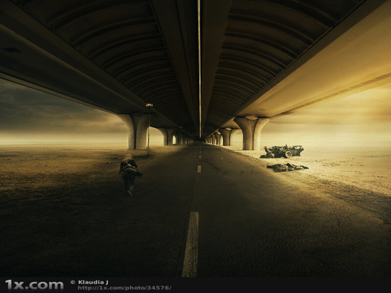 Desolate highway under bridge