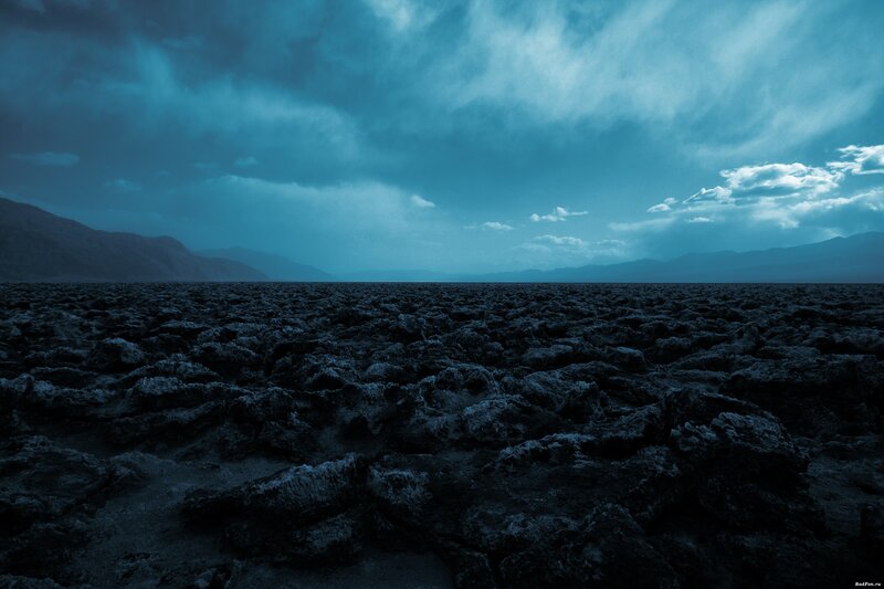 Desolate landscape under stormy sky