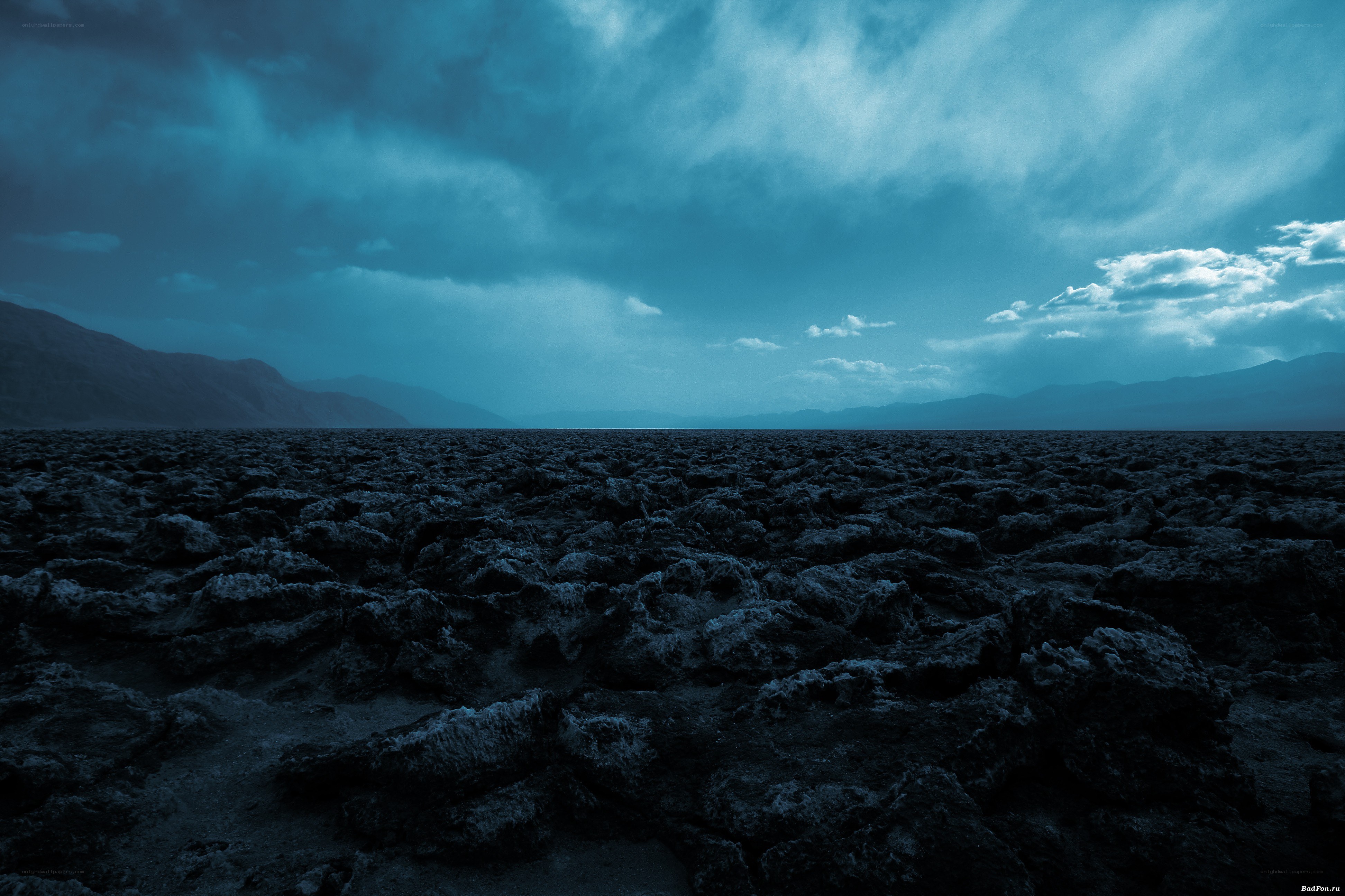Desolate landscape under stormy sky